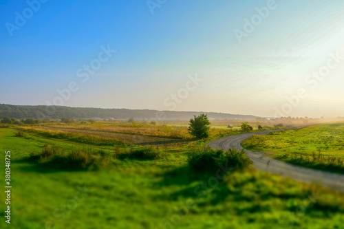 Morning sunrise over wide fields and meadows  countryside  Tilt-Shift effect 