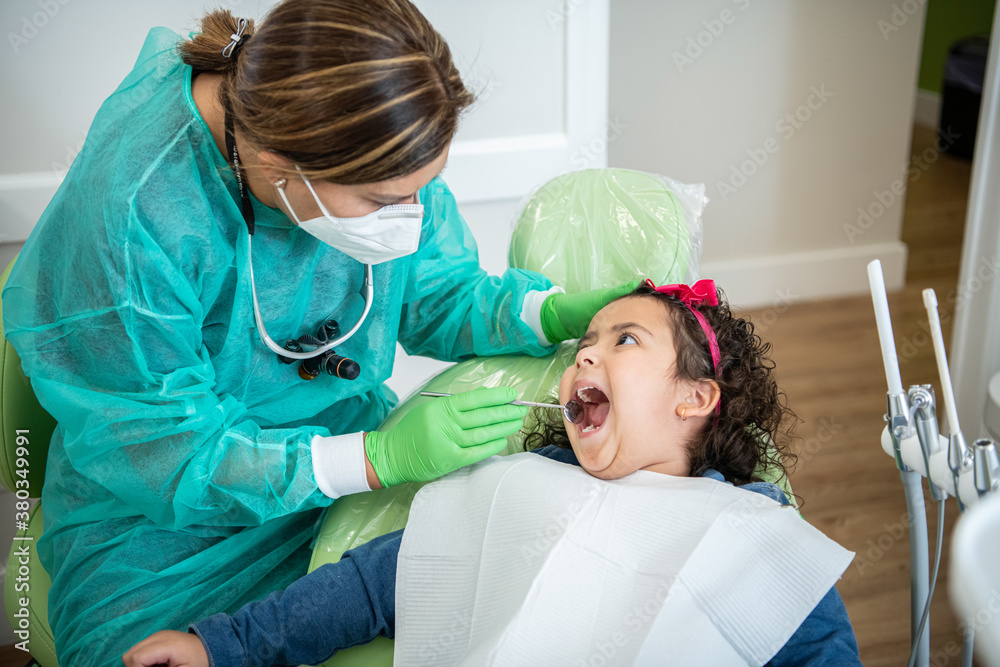 dentist examining a young patient