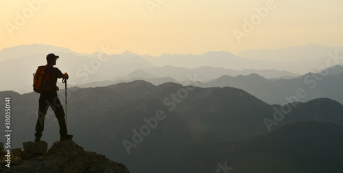 adventurous mountaineer watching the mountains © Silhouette Media
