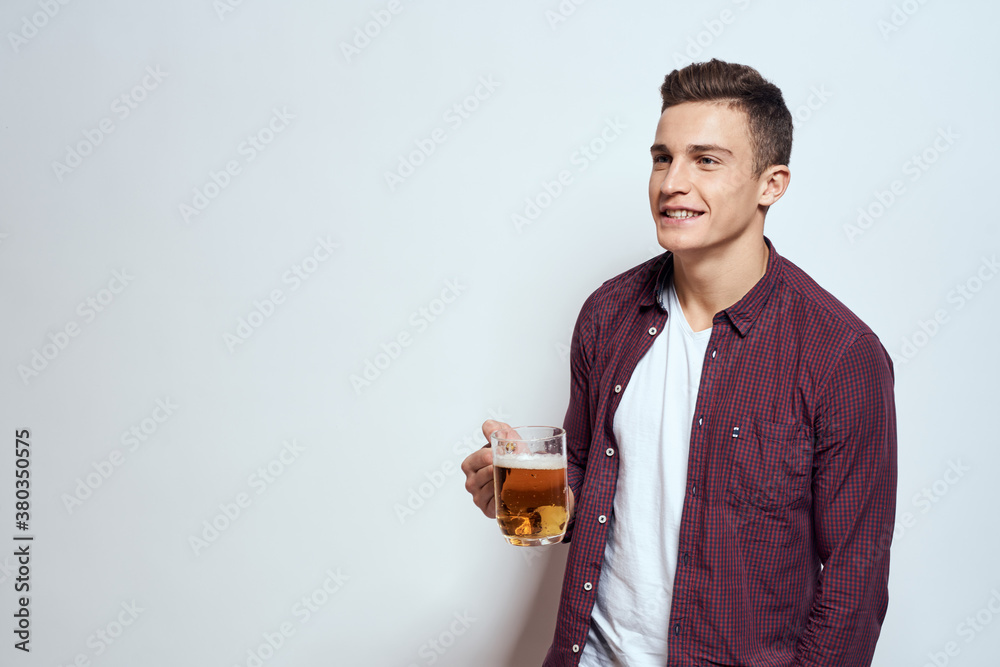 Man with a mug of beer fun alcohol lifestyle shirt light background Man with a mug of beer fun alcohol lifestyle shirt light background
