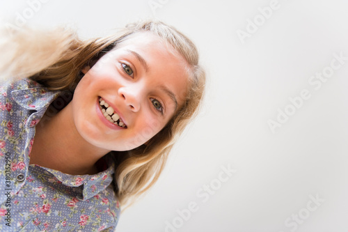 Portrait of smiling blonde girl (8-9)