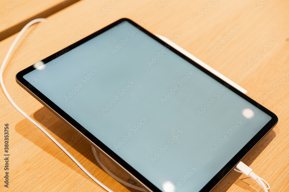Tablet with blank screen on table Tablet with blank screen on table