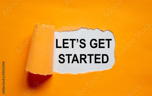 Foto The text 'lets get started' appearing behind torn orange paper