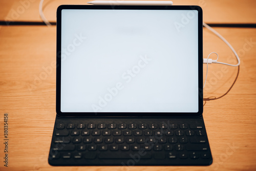 Empty screen of tablet with keyboard