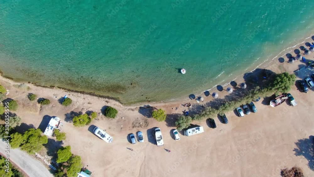 Aerial view of turquoise clear water and sandy beach of Ireon or Limni Vouliagmeni Lake in Peloponnese, Greece Aerial view of turquoise clear water and sandy beach of Ireon or Limni Vouliagmeni Lake in Peloponnese, Greece