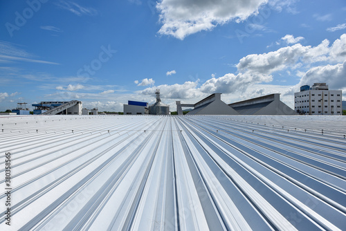 Roofing and lightning faraday systemon installed on new warehouse with exsiting old building warehouse and blue sky background