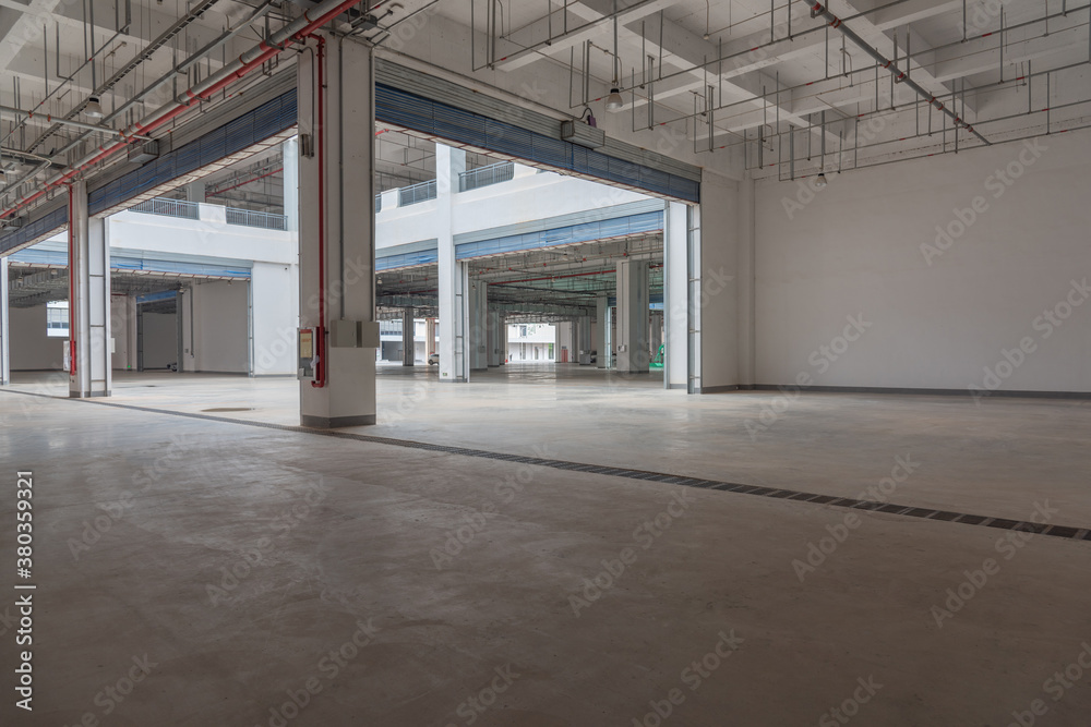 Large concrete warehouse indoor space