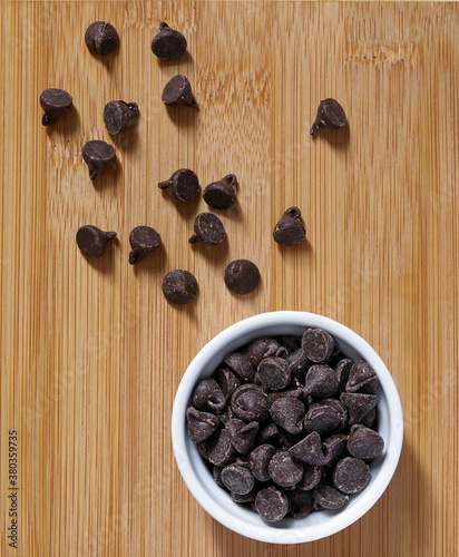 Stack of chocolate chips in ramekin photo