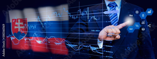 Businessman touching data analytics process system with KPI financial charts, dashboard of stock and marketing on virtual interface. With Slovakia flag in background. photo