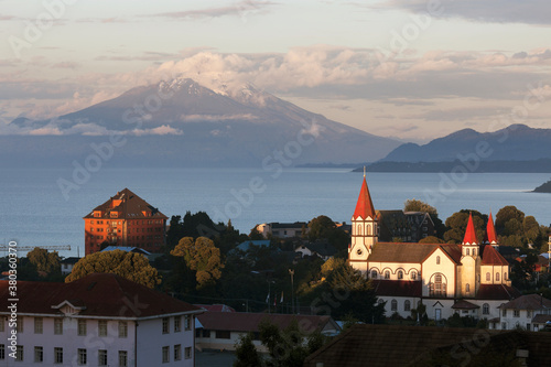 Town skyline with volcano in background