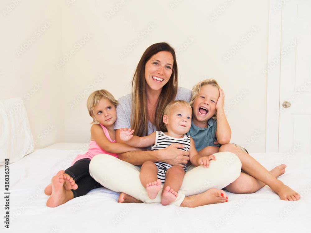 Mother with three kids (6-7, 2-3, 6-11 months) Mother with three kids (6-7, 2-3, 6-11 months)