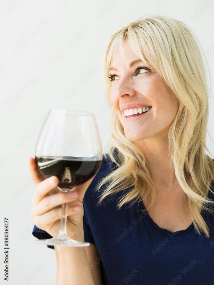 Studio portrait of blonde woman with wineglass Studio portrait of blonde woman with wineglass
