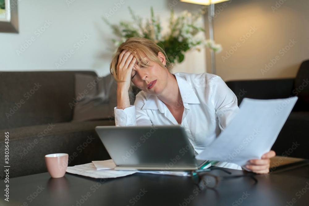 Portrait of overworked woman using computer Portrait of overworked woman using computer