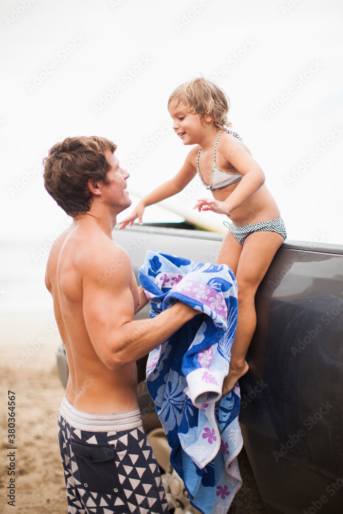Baby girl (2-3) with father on beach Baby girl (2-3) with father on beach