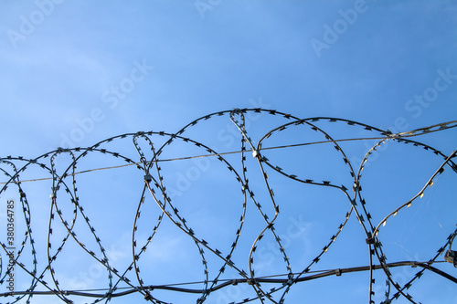 The Barbed-Wire Fence. The symbol of boundaries, danger, bondage