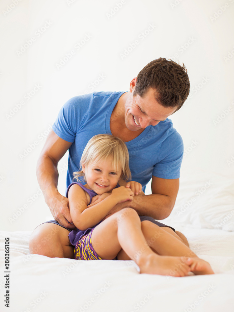 Father playing with daughter (2-3)