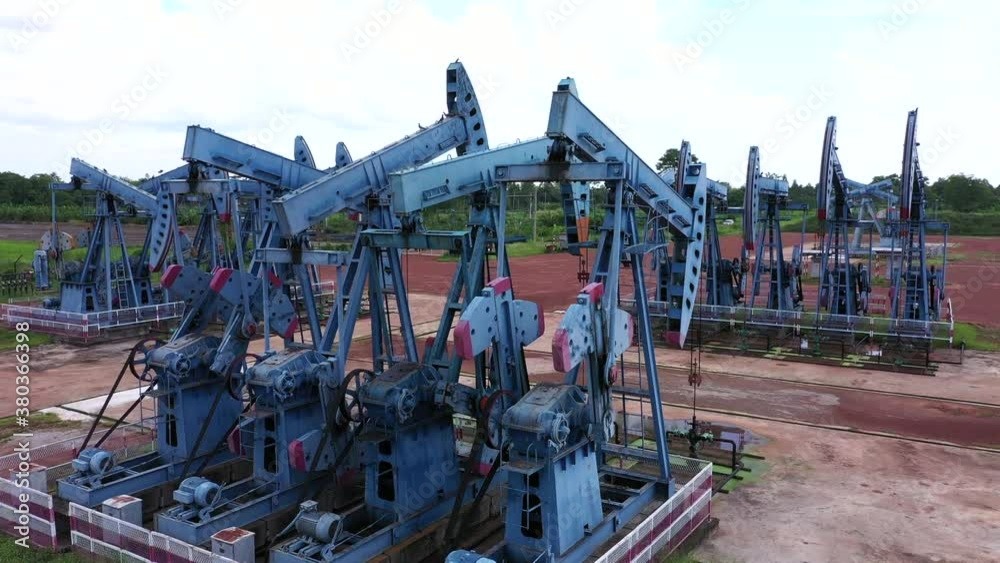 Working Pumpjack industrial oil pump jack working and pumping crude oil