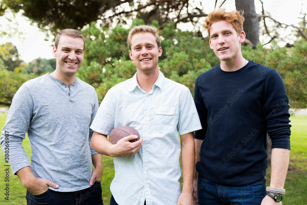 Portrait of young men with football Portrait of young men with football
