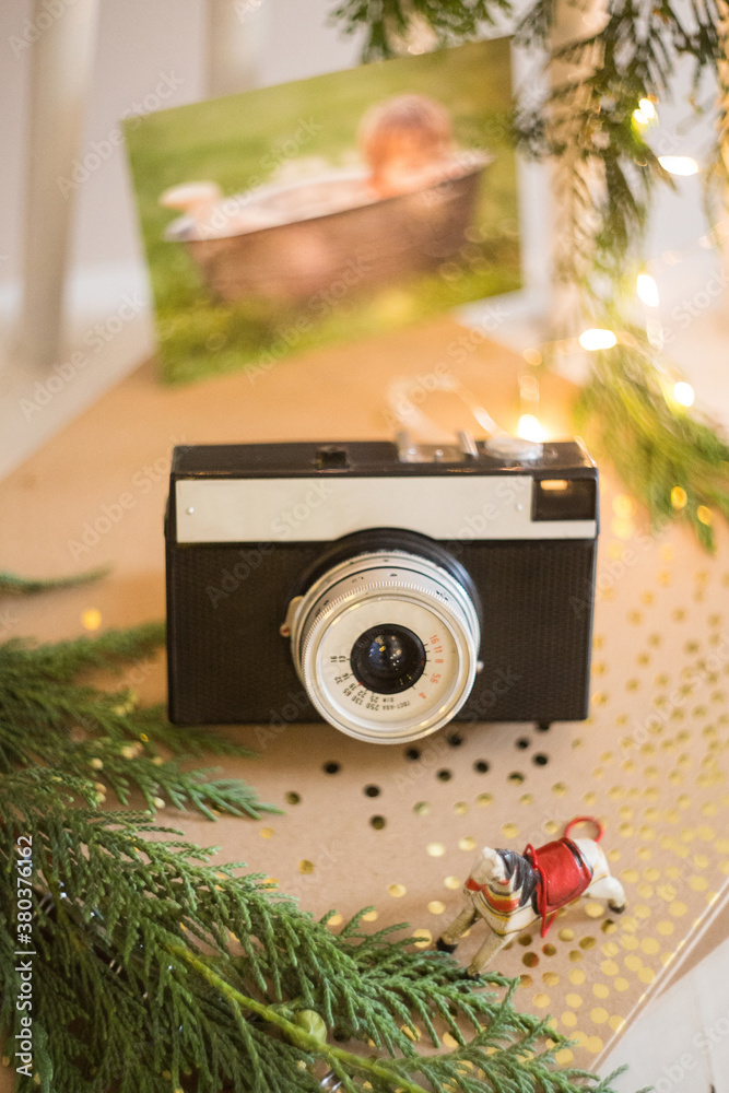 retro analog photo camera in Christmas scenery.