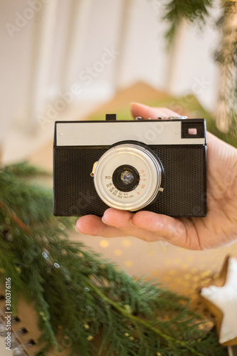 Obraz na płótnie retro analog photo camera in Christmas scenery. w salonie
