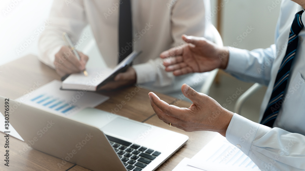 Business colleagues coaching with sales report at workplace. Business colleagues coaching with sales report at workplace.