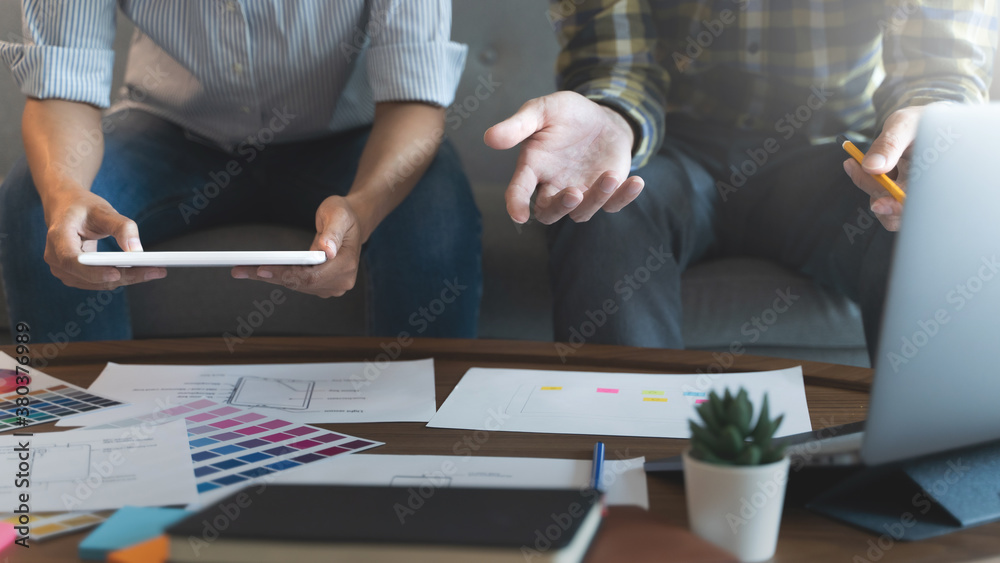 Fototapeta premium UX UI applications designer working for smart phone interface.