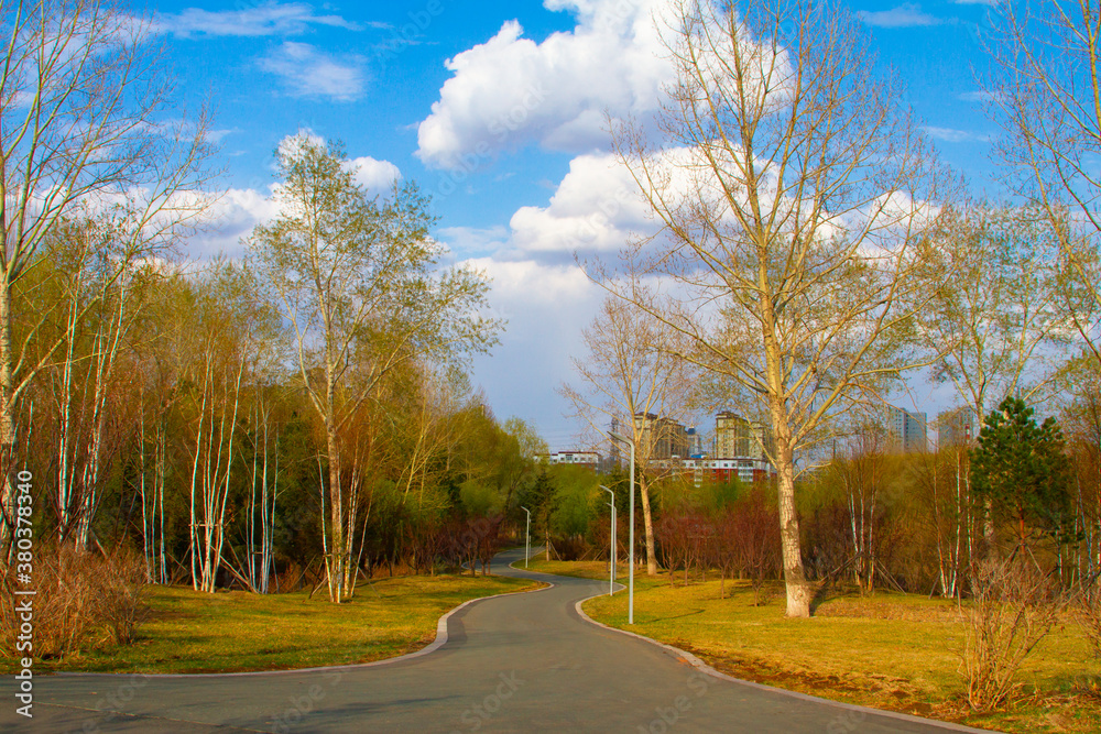 A paved road through park in spring in China