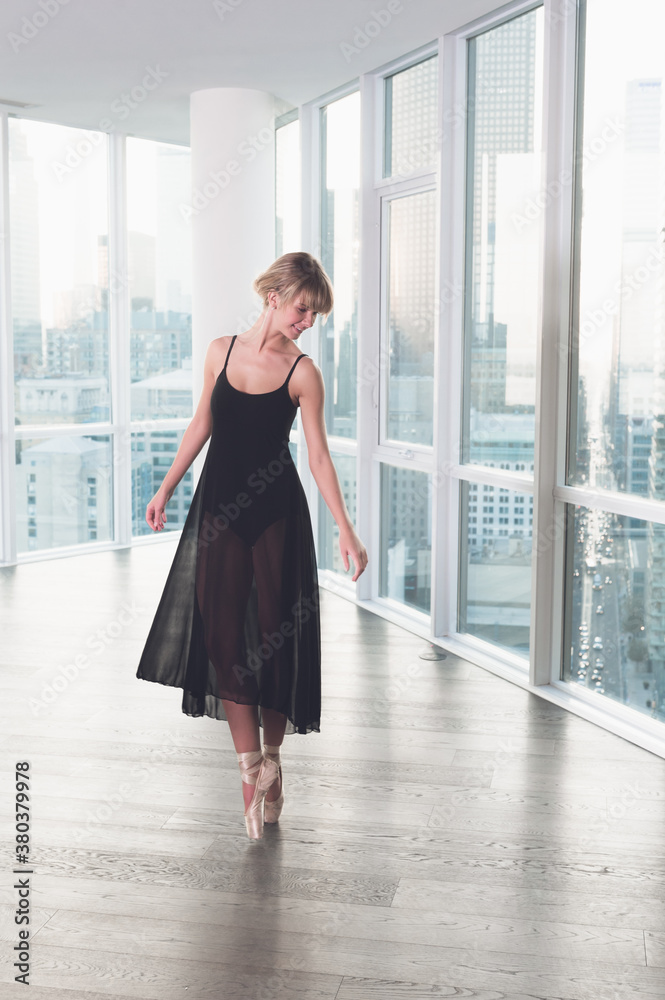 Ballerina dancing with city in background Ballerina dancing with city in background