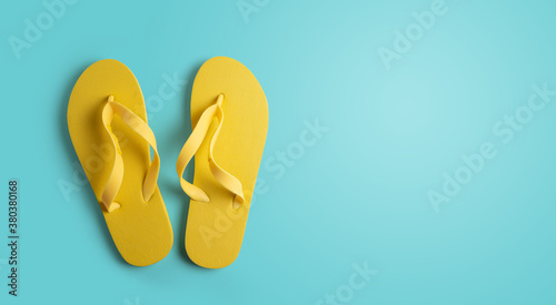 Yellow beach sneakers on a blue background with space for your text. summer concept