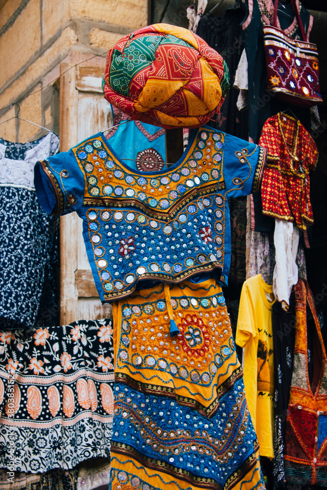 Traditional Rajasthani dress for sale on a curio shop. Stock Photo Adobe Stock