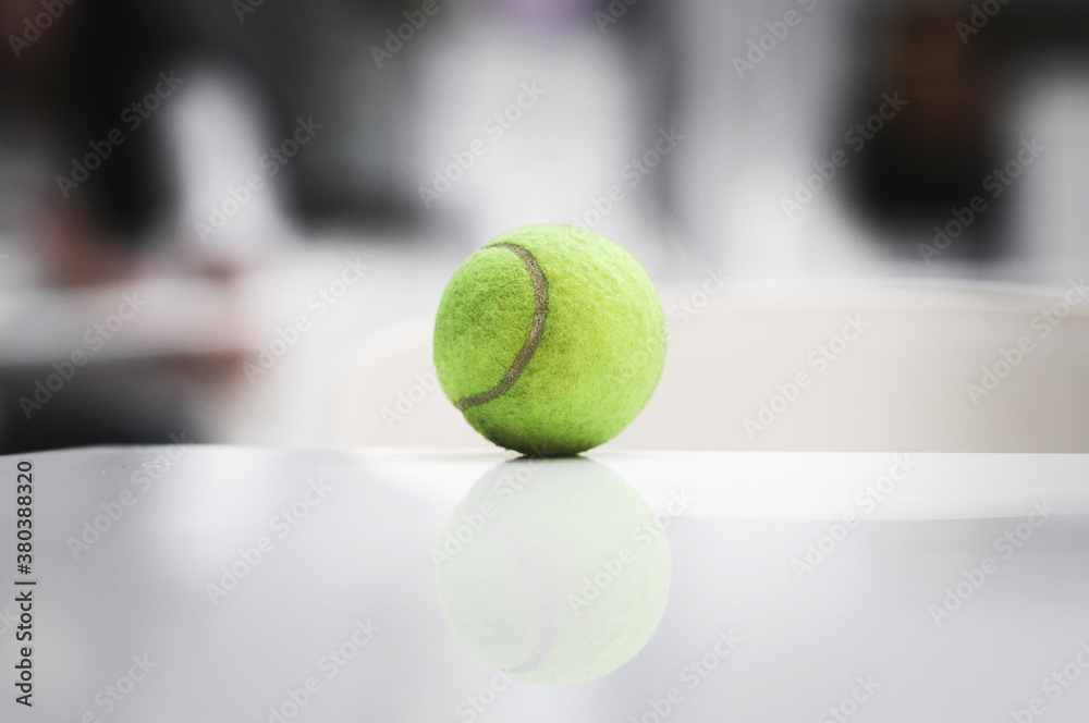Tennis balls placed on the table.