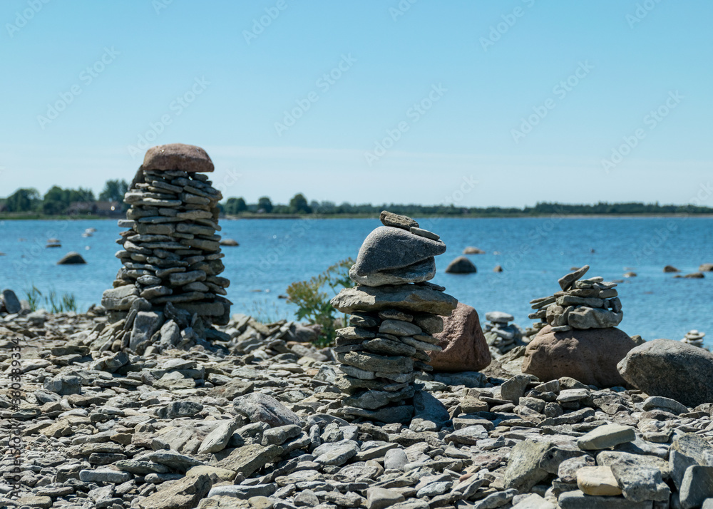 beautiful white stone piles by the sea, these objects were built by travelers, Saaremaa Island, Estonia
