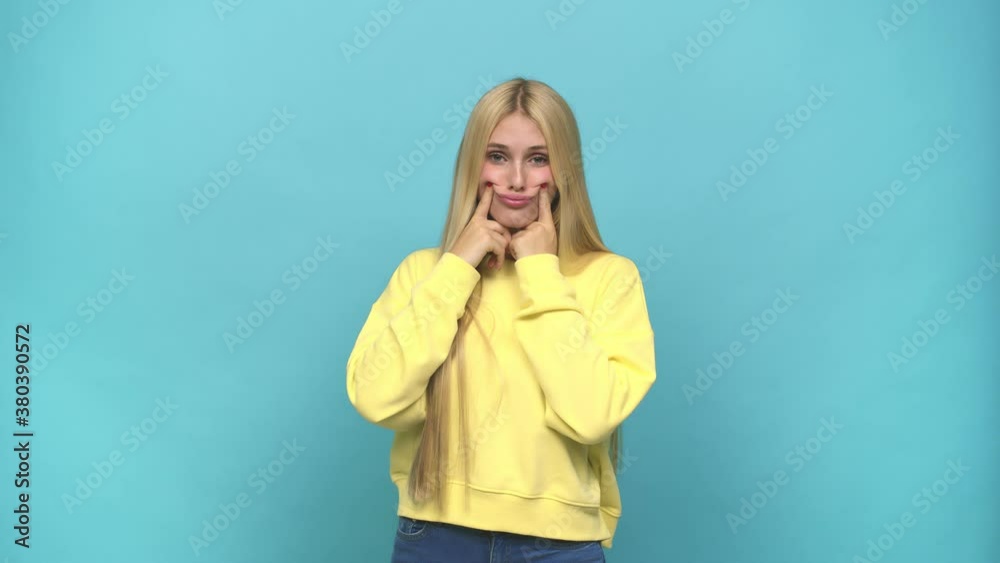 Young caucasian blonde woman doubting between two options Young caucasian blonde woman doubting between two options