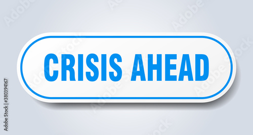 crisis ahead sign. rounded isolated button. white sticker