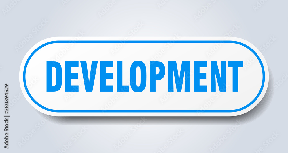 development sign. rounded isolated button. white sticker