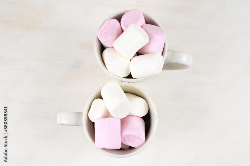 Hot chocolate cups with marshmallows. Christmas holiday mood concept. Cozy winter background. Hot chocolate cups with marshmallows. Christmas holiday mood concept. Cozy winter background.