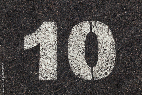 Number 10 Printed on White Over Dirty Asphalt photo