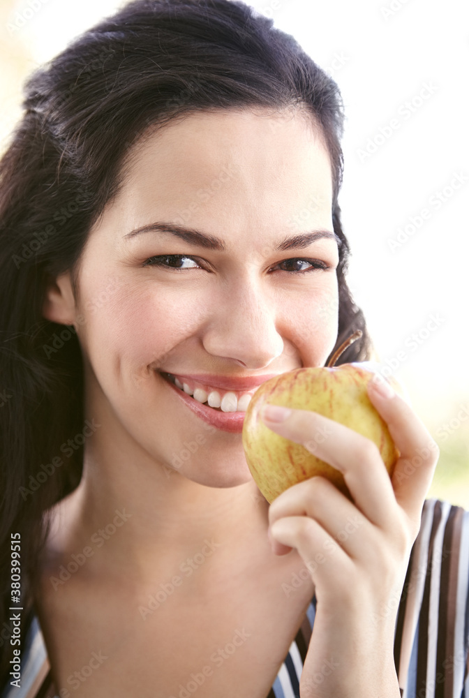 Beautiful hispanic woman eating an apple Beautiful hispanic woman eating an apple