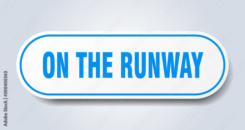 on the runway sign. rounded isolated button. white sticker on the runway sign. rounded isolated button. white sticker