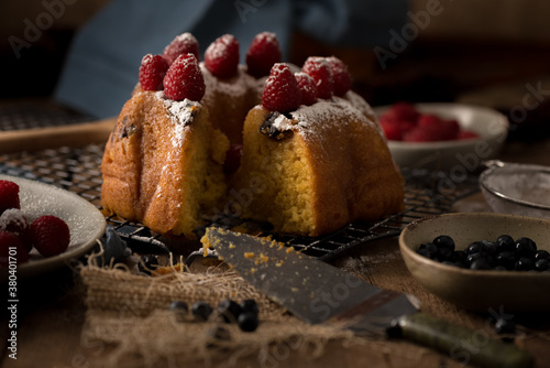 Rum Cake with Raspberries and Icing Sugar photo