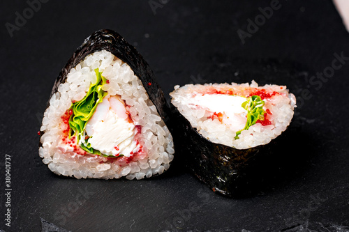 sushi rolls on a black background