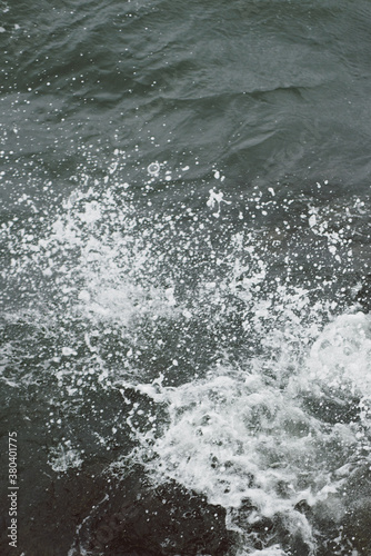 Wallpaper Mural Ocean water crashing into seaweed covered rocks on a stormy day Torontodigital.ca