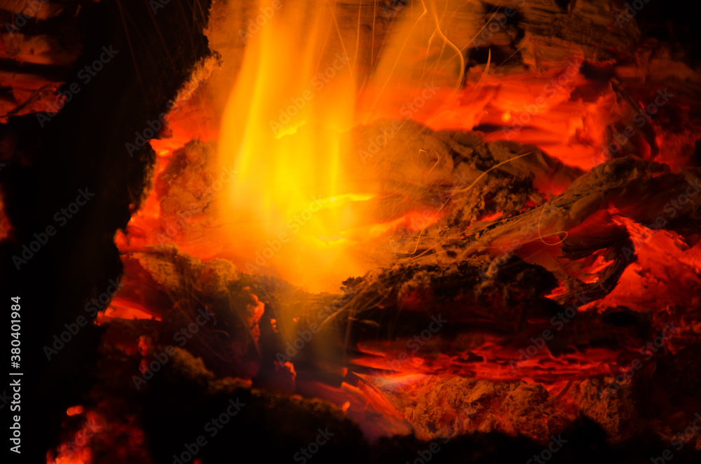 Fototapeta premium embers burn down in a hardwood fire