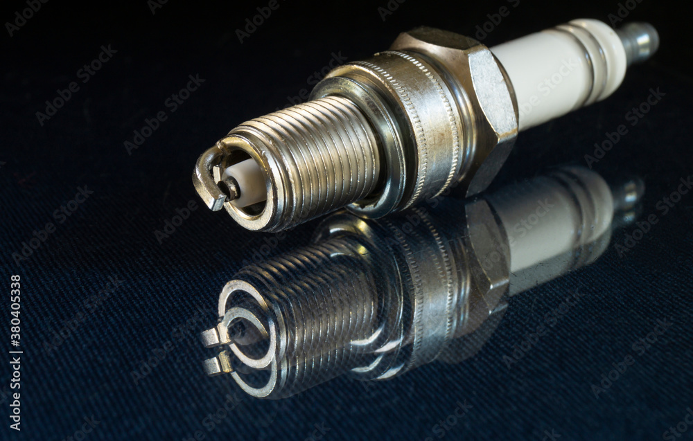 Spark plug for car on black background Spark plug for car on black background