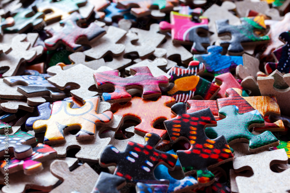 Fototapeta premium Disassembled puzzle colored pieces