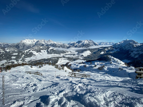 Scenic view Lofer Mountains, Leogang Mountains and ski slopes of Fieberbrunn, Austria against blue sky.