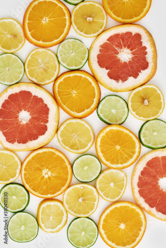 Top view of citrus fruits  Orange  tangerine  lemon  lime and grapefruit slices or circles isolated over white background