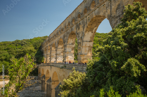 Avignon, France - 6/4/2015:  Pont du Gard, a Mighty aqueduct bridge rising over 3 well-preserved arched tiers, built by 1st-century Romans. photo