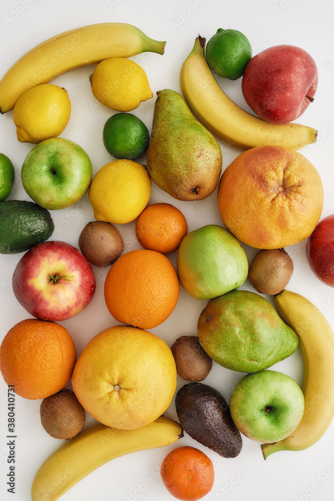 Top view of various colorful fresh summer fruits isolated over white background Top view of various colorful fresh summer fruits isolated over white background