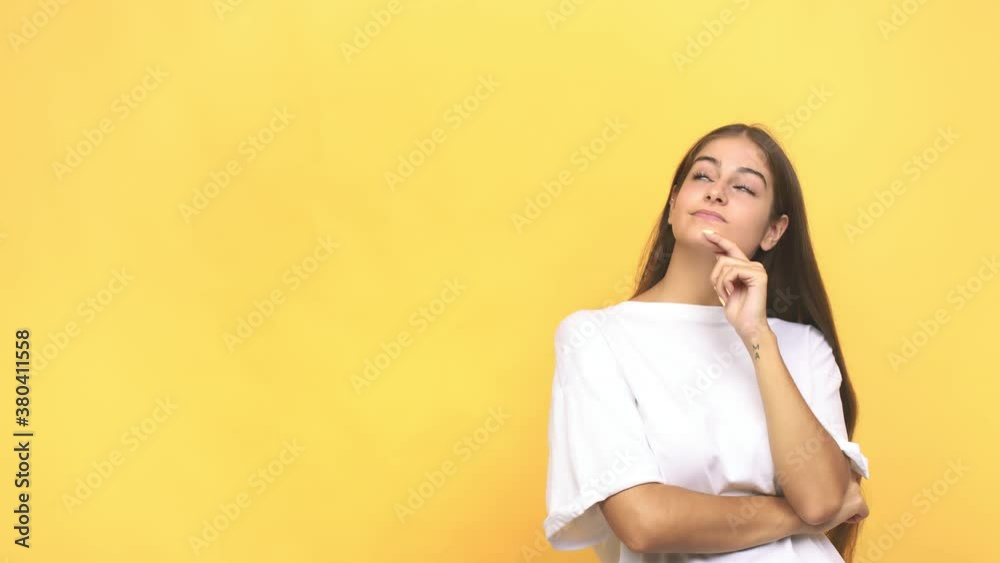 Young caucasian woman looking sideways with doubtful and skeptical expression Young caucasian woman looking sideways with doubtful and skeptical expression